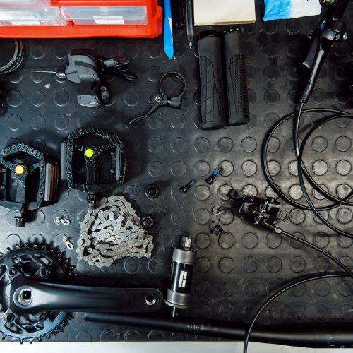 Bicycle workshop, cycle parts on the table closeup