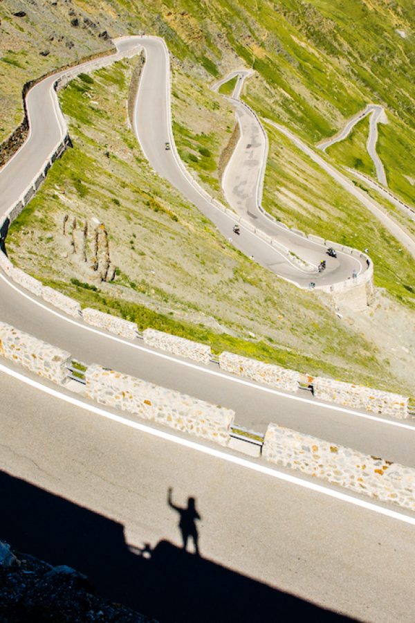 Biker silhouette on the top of famous Passo Dello Stelvio hill